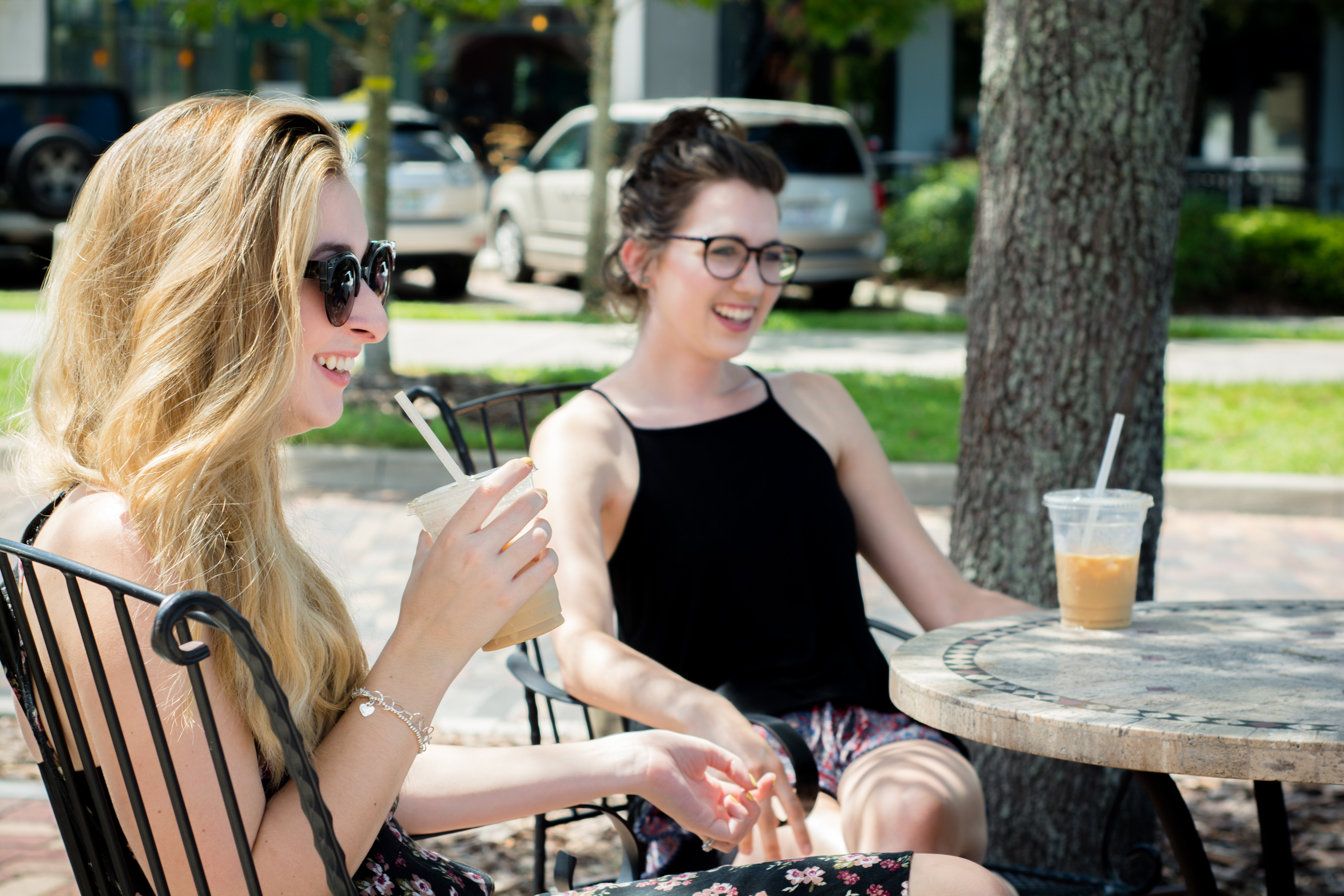 women drinking iced coffee in orlando