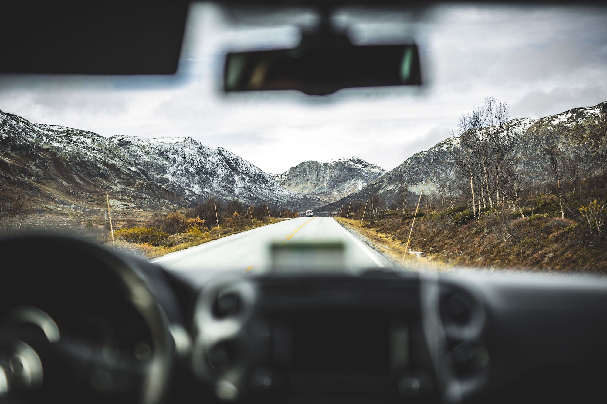 Travel-Breaks Mountain views through windshield of moving car