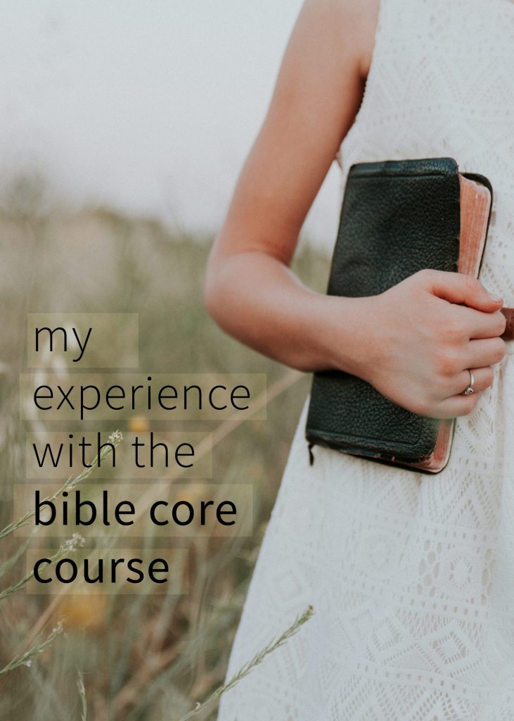 woman holding bible in a field