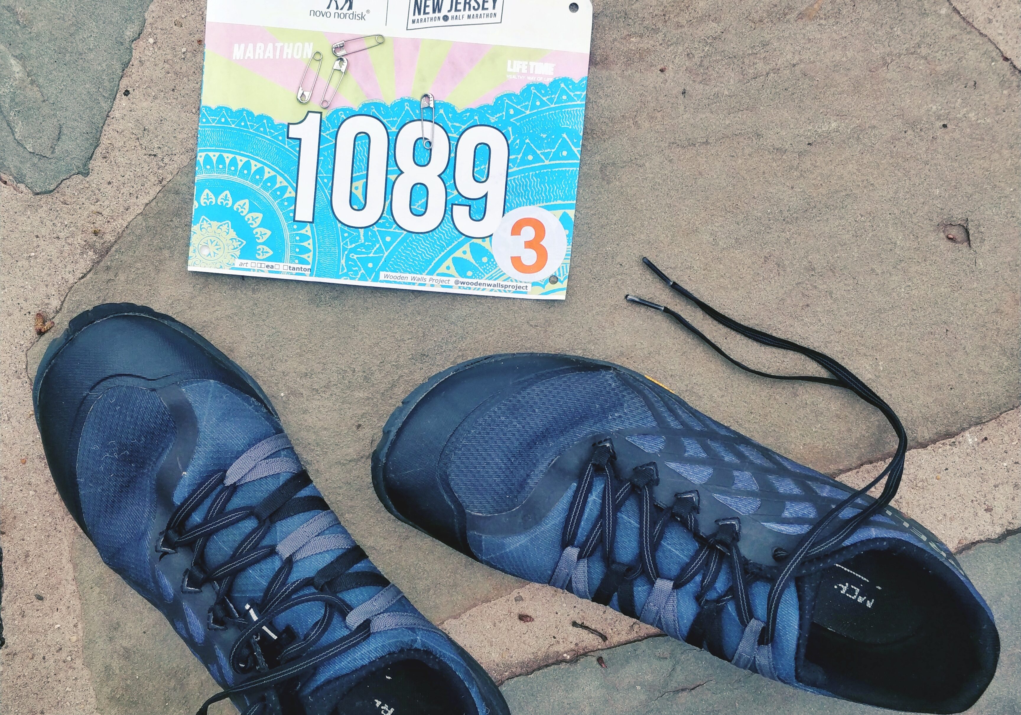 minimalist running shoes and a race bib for new jersey marathon